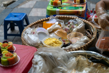 Vietnamese steamed glutinous rice in bowl for vendor sale on Hanoi street. Xoi xeo in Vietnamese
