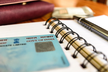 Kolkata India Jan 2019 - Close up of Government of India on Pan card (permanent account number). Soft focus, shallow DOF. Aadhaar is a 10-digit identity allotted to taxpayer by Income Tax Department.