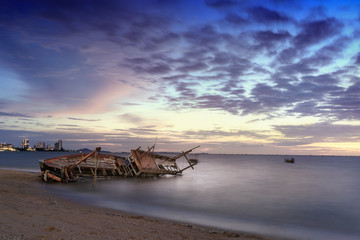  seascape with Shipwreck boat in the ocean in morning time