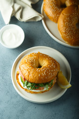 Salmon arugula bagel with cream cheese
