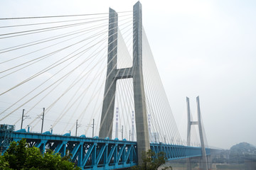 Fototapeta na wymiar The high-speed train runs at high speed on the railway bridge. The Yangtze River Bridge of Chongqing Railway, China