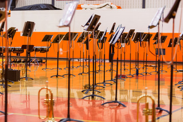 forest of music stands all prepared for the concert