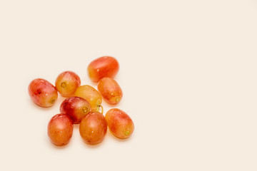 Red ripe grapes on neutral background
