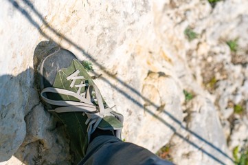 soldier in camouflage aiming with rifle