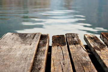 Wooden bridge for passenger boat landing in the reservoir