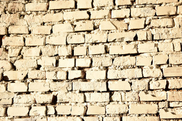 The photo shows a white brick wall.