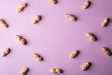 Peanut minimal pattern on purple background backdrop food nut texture