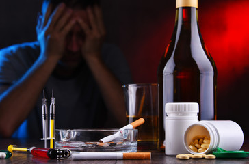Fototapeta na wymiar Addictive substances and the figure of a addicted man