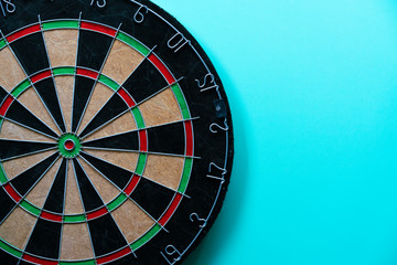 Obraz premium target dart board on the green table, center point, head to target marketing and business success concept