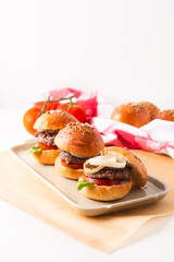 Food concept Homemade beefs hamburgers serve on square plate on white background with copy space