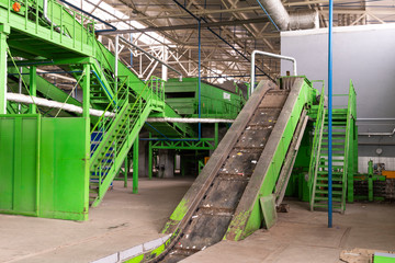 Fototapeta na wymiar Waste processing plant. Technological process for acceptance, storage, sorting and further processing of waste for their recycling.