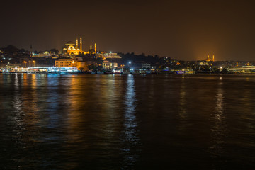 Fototapeta na wymiar Istanbul night cityscape viewed form Galata Bridge with the illuminated Suleymaniye Mosque, Turkey