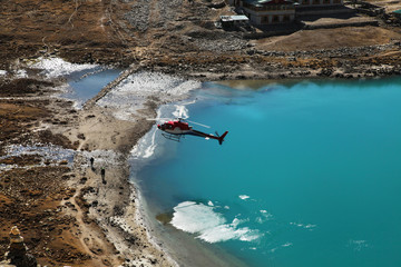 The helicopter over Gokyo lake, Trekking in Everest region, Nepal