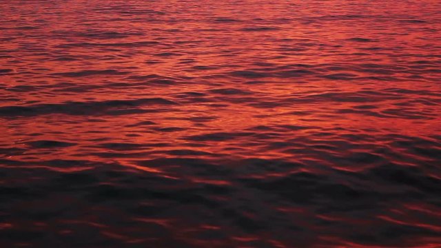 Smooth red ocean water ripples background