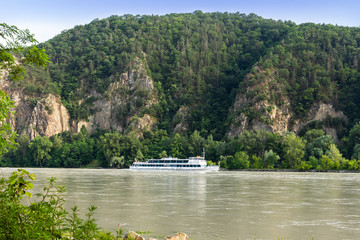 Tourist ship on the Danube river in Wachau valley.