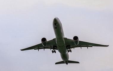 Fototapeta na wymiar air plane in the blue sky front closeup view