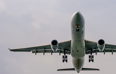 air plane in the blue sky front closeup view