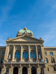 Fototapeta na wymiar Bern, Switzerland - Jun 1st 2019: The Parliament Building or, The Federal Palace consists of a central assembly building and two wings housing government departments and a library.
