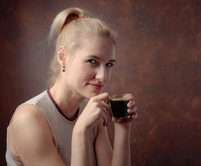 Portrait of a beautiful mid age woman with cup of coffee.