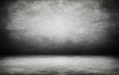 Grunge interior room with concrete wall and floor. Empty concrete space.