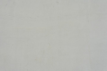 Texture of a concrete wall with cracks and scratches which can be used as a background