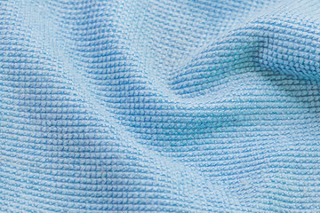 Close up of  blue wave microfiber fabric texture with copy-space.