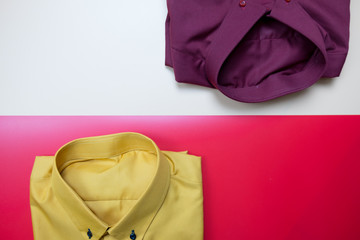 Yellow and red shirts folded for men