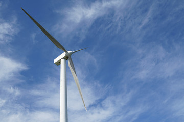 Wind generator blade in sunny blue sky day