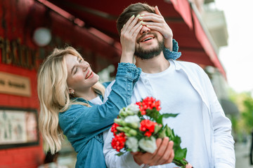 Funny woman having date with her boyfriend near cafe
