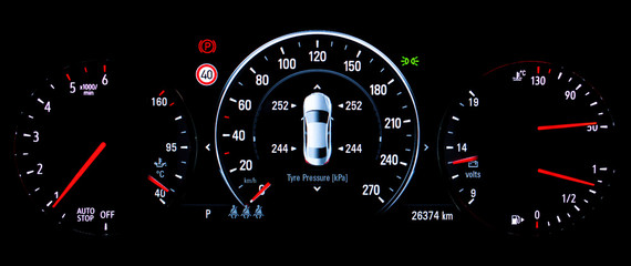 Fototapeta premium TPMS (Tyre Pressure Monitoring System) monitoring display on car dashboard panel. The pressure measurement given in kilopascal (kPa). Digital screen shows right correct tire pressure.