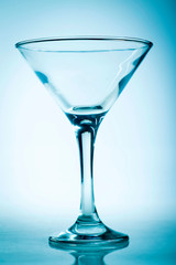 A martini glass on a blue background