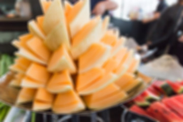 Blurred image for background of melon tower at fruits station.