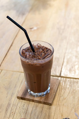 Iced cocoa drink served on wooden table at coffee shop cafe' 
