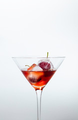 red cocktail with cherries