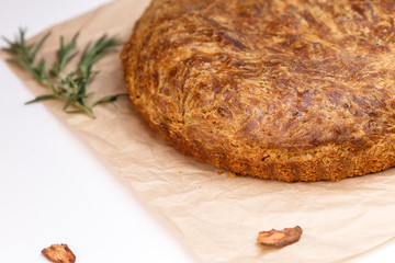  Freshly baked vegetarian pie homemade on craft paper.