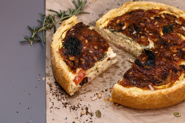  Freshly baked vegetarian pie homemade on craft paper.