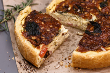  Freshly baked vegetarian pie homemade on craft paper.