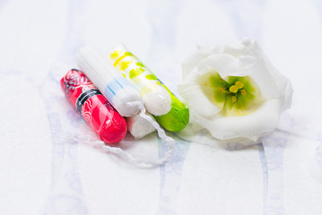 Obraz na płótnie Canvas Hygienic white tampon for women. Cotton swab. Menstruation, means of protection. 