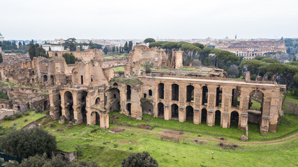 Obraz premium Aerial view of the ancient remains of buildings in the historic city of Rome, Italy. Drone photography