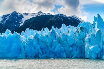 Blue Iceberg of Gracier Grey with the beautiful mountain and Lake Grey