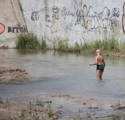 boy fishes on the river