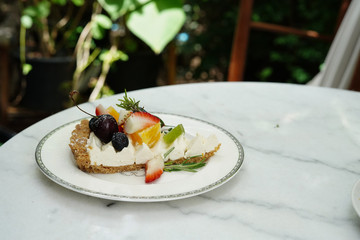 Delicious cake Beautifully decorated and served to customers. Lifestyle of people who want to relax by eating and sweets. Tea time with dessert in cafe.