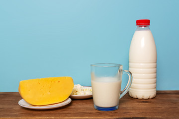 Jewish holiday - Shavuot. Dairy products and fruits over wooden table.