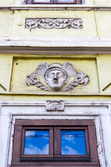 Mercury head with caduceus, decoration of an old building in Cluj-Napoca, Transylvania, Romania,...