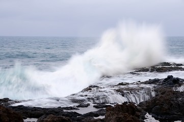 Waves crashing on rocks