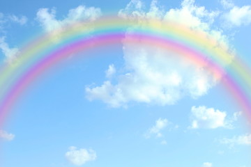 beautiful colorful rainbow in the blue sky with cloud as background