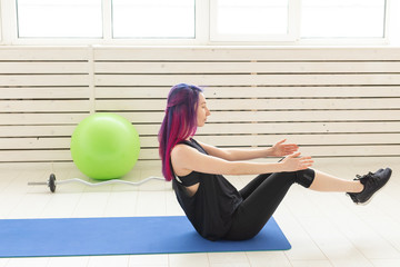 Sport, yoga, people concept - Sporty young woman practicing yoga indoors