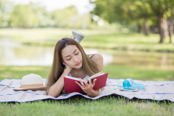 Student girl read book at park