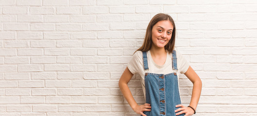 Young hipster woman with hands on hips