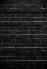 Desaturated monochrome brick wall background. Clean black and white brickwork copy space wall grunge vintage texture. 